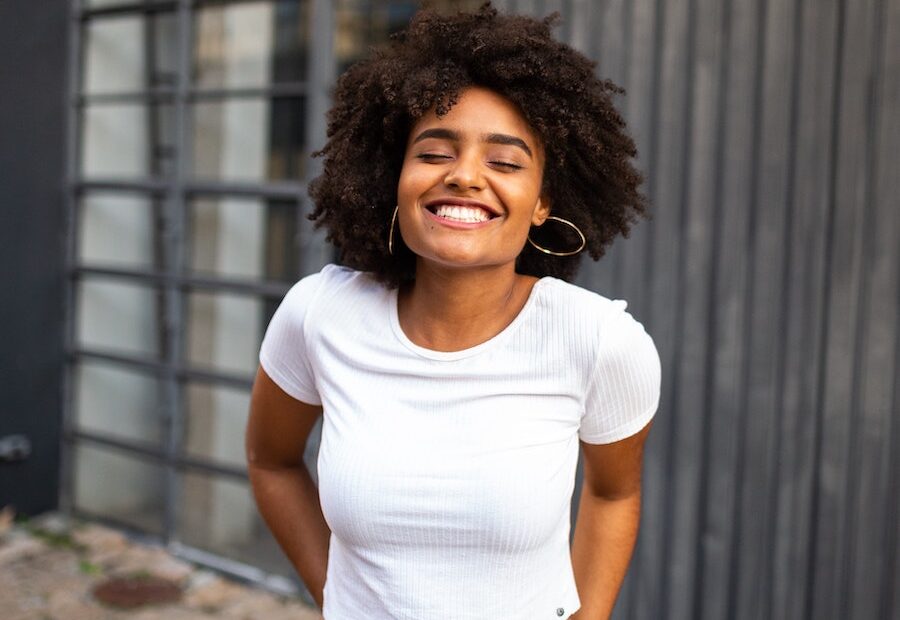 beautiful woman with curly hair smiling